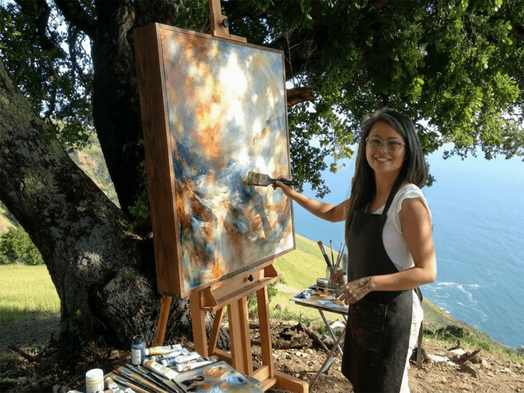 There is an inventor of kinetic light, right in front of one of her prototype. There are Whispering Pods. It's a sort of an Inventor, Marlene Krueger. This is  not just moving shadows but burst of colors moving, kinetic light mixed with acrylic paint.